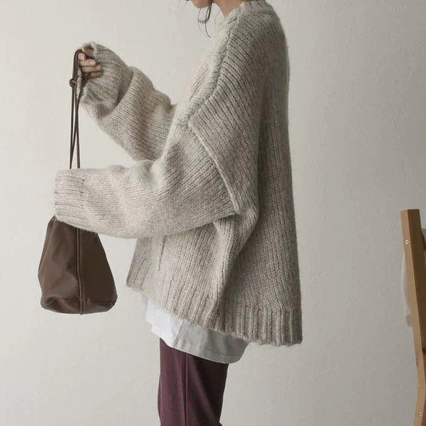 Détail de la poche frontale du pull femme oversize