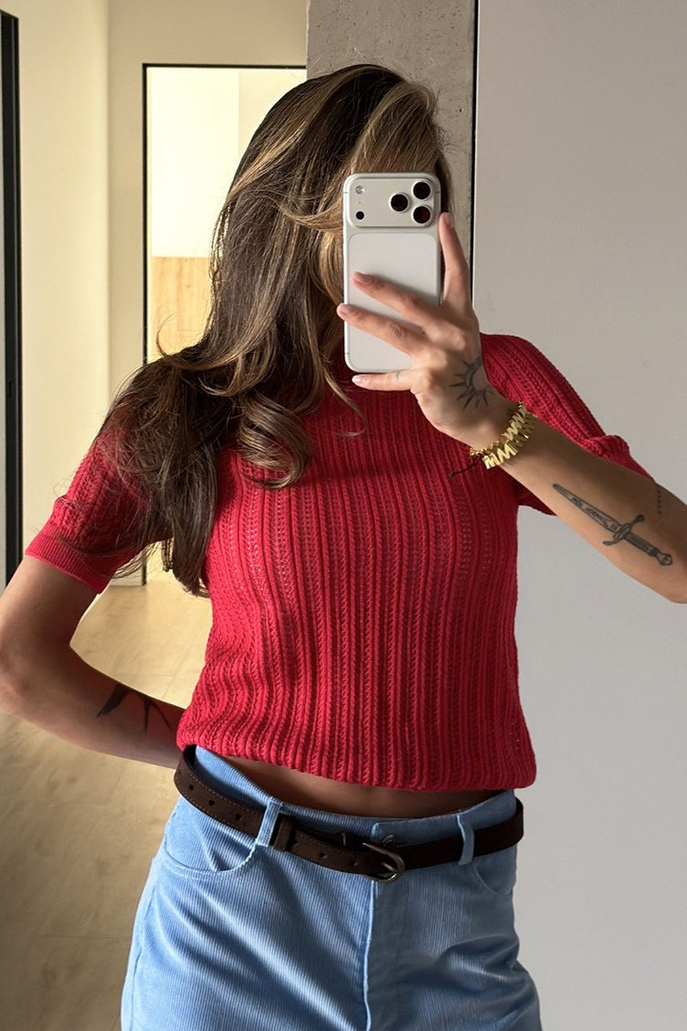 Manche courte et finition du pull femme en maille ajourée