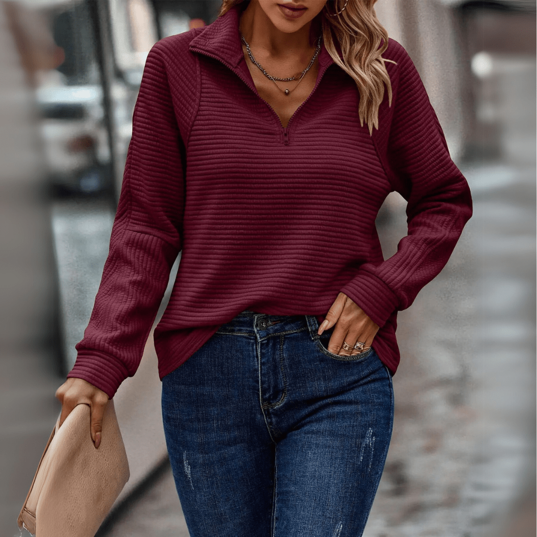 Vue rapprochée de la texture du pull à demi-zip
