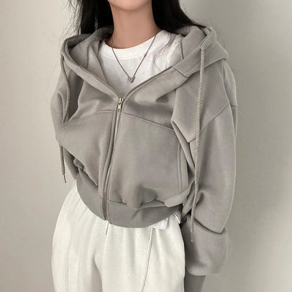 Vue arrière d’une veste sweat femme zippée à coupe ample