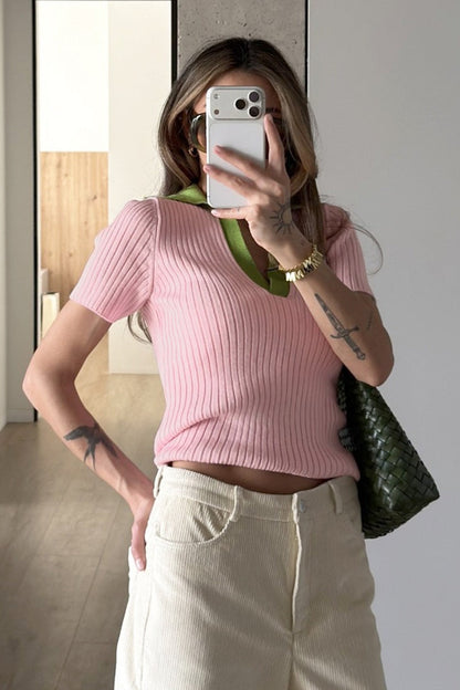 Pull polo femme vert montrant sa coupe confortable