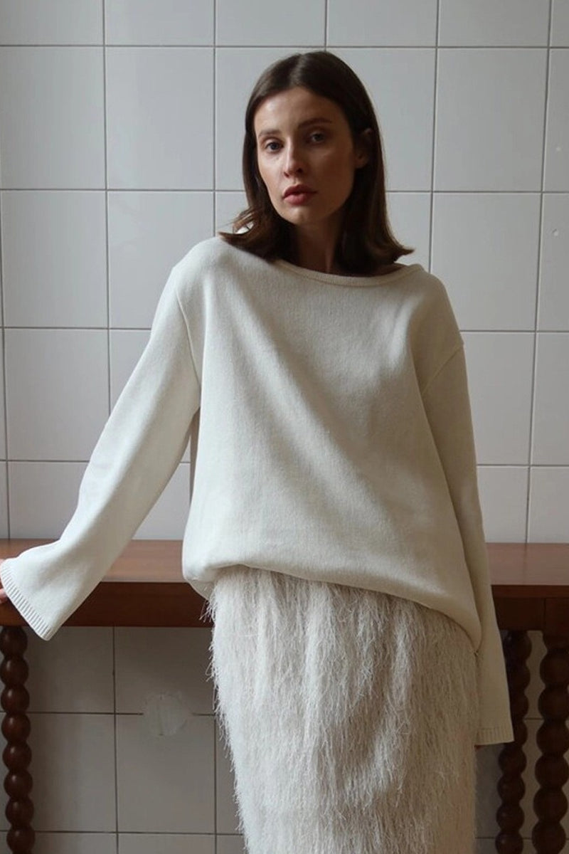 Vue rapprochée de la texture tricotée du pull femme