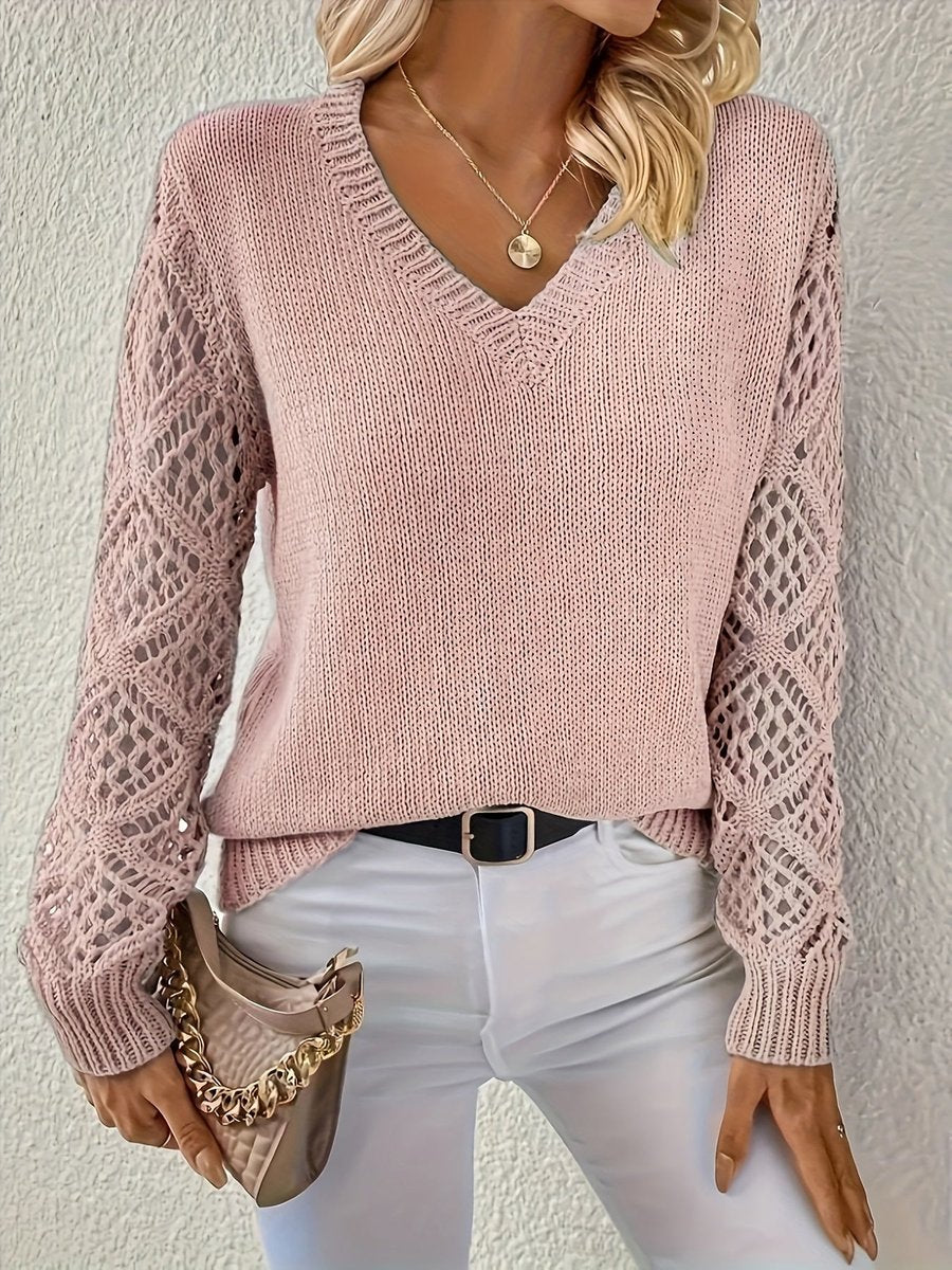 Détail de la texture tricotée du pull femme